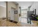 Well-lit kitchen featuring stainless steel appliances, granite countertops, and tile flooring at 4854 S Hill View Dr, Charlotte, NC 28210
