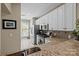 Spacious kitchen featuring stainless steel appliances, granite countertops, and white cabinets at 4854 S Hill View Dr, Charlotte, NC 28210