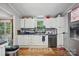 Bright kitchen featuring white cabinetry, stainless steel appliances, and backyard views at 4921 Sierra Dr, Maiden, NC 28650
