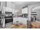 Efficient kitchen with stainless steel oven, dark countertops, and plentiful cabinet space at 4921 Sierra Dr, Maiden, NC 28650