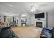 Open-concept living room with fireplace flows into dining area at 4921 Sierra Dr, Maiden, NC 28650