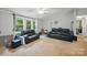 Living room features a large window, ceiling fan, and furniture at 4921 Sierra Dr, Maiden, NC 28650