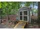 Backyard shed with a wood ramp for easy access, perfect for storage and hobbies at 4921 Sierra Dr, Maiden, NC 28650