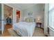 Bright bedroom with minimalist decor, natural light, and hardwood flooring for a comfortable and stylish space at 5256 Meadowcroft Way, Fort Mill, SC 29708