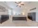 Inviting bedroom with neutral carpeting, modern furniture, and ample natural light creating a serene atmosphere at 5256 Meadowcroft Way, Fort Mill, SC 29708
