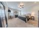 Spacious bedroom featuring neutral carpet, ample natural light, and contemporary furnishings for a relaxing retreat at 5256 Meadowcroft Way, Fort Mill, SC 29708