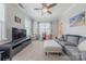 Bonus room features plush carpeting, a large sofa and a large flatscreen tv at 5256 Meadowcroft Way, Fort Mill, SC 29708