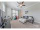The bonus room has plush carpeting, a big sofa, and a big flat-screen TV at 5256 Meadowcroft Way, Fort Mill, SC 29708