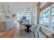 View of the dining area leading to kitchen and living space with plenty of natural light at 5256 Meadowcroft Way, Fort Mill, SC 29708