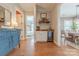Hallway with wine rack and beverage fridge leading to the dining area and bedroom at 5256 Meadowcroft Way, Fort Mill, SC 29708
