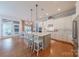 Spacious kitchen with a large center island and white cabinetry open to dining area at 5256 Meadowcroft Way, Fort Mill, SC 29708