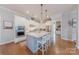 Gourmet kitchen featuring a central island with seating, stainless steel appliances, and custom cabinetry at 5256 Meadowcroft Way, Fort Mill, SC 29708