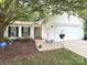 Charming single-Gathering home featuring white siding, a well-manicured lawn, and a two-car garage at 5434 Starflower Dr, Charlotte, NC 28215