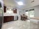 Inviting kitchen with dark cabinets, stainless steel appliances, and a charming eat-in dining area at 5434 Starflower Dr, Charlotte, NC 28215