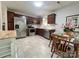 Modern kitchen equipped with stainless steel appliances, ample counter space, and an adjacent dining area at 5434 Starflower Dr, Charlotte, NC 28215