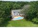 Expansive backyard with a private in-ground pool and mature trees surrounding the property at 5632 Zion Church Rd, Concord, NC 28025