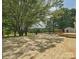Large, newly built wooden deck overlooks a grassy field and trees at 5632 Zion Church Rd, Concord, NC 28025
