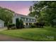 Charming two-story home with a large front yard, covered porch, and mature trees at 5632 Zion Church Rd, Concord, NC 28025