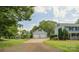 Detached two-car garage with a long driveway and trees in the background at 5632 Zion Church Rd, Concord, NC 28025