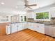 Spacious kitchen with ample counter space, white cabinetry, and stainless steel appliances at 5632 Zion Church Rd, Concord, NC 28025