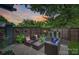 Inviting outdoor patio space with comfortable seating, lush greenery, and a privacy fence, ideal for relaxing and entertaining at 622 Mattie Rose Ln, Charlotte, NC 28204