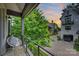 Relaxing balcony view with comfortable seating, overlooking the neighborhood street at sunset at 622 Mattie Rose Ln, Charlotte, NC 28204