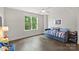 Comfortable bedroom with a daybed, large window, and hardwood floors for relaxing and restful nights at 622 Mattie Rose Ln, Charlotte, NC 28204