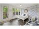 Charming bedroom with hardwood floors, floral wallpaper, and a backyard view at 622 Mattie Rose Ln, Charlotte, NC 28204