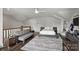 Bedroom featuring a bed, sitting area, ceiling fan, and hardwood flooring at 622 Mattie Rose Ln, Charlotte, NC 28204