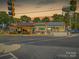 Commercial building featuring diverse retail spaces, outdoor patios, and prominent street visibility, attracting local customers at 622 Mattie Rose Ln, Charlotte, NC 28204