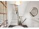 Bright foyer with hardwood floors, white wainscoting, staircase, and stylish decor at 622 Mattie Rose Ln, Charlotte, NC 28204