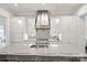This spacious kitchen features an island with quartz countertops, stainless steel appliances, and a decorative tile backsplash at 622 Mattie Rose Ln, Charlotte, NC 28204