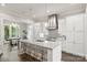 Stylish kitchen with a central island, quartz countertop, stainless steel hood, and backsplash at 622 Mattie Rose Ln, Charlotte, NC 28204