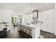 Bright, open kitchen with a large island, stainless steel appliances, and modern pendant lighting at 622 Mattie Rose Ln, Charlotte, NC 28204