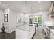 A spacious kitchen with stainless steel appliances is adjacent to the dining room at 622 Mattie Rose Ln, Charlotte, NC 28204