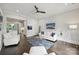 A stylish living room with a ceiling fan provides access to the kitchen at 622 Mattie Rose Ln, Charlotte, NC 28204