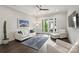 A bright and airy living room features a modern ceiling fan and balcony access at 622 Mattie Rose Ln, Charlotte, NC 28204