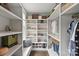 Organized walk-in closet with custom shelving, shoe racks, and ample hanging space at 622 Mattie Rose Ln, Charlotte, NC 28204