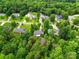 Bird's eye view showcases the house and neighborhood surrounded by lush greenery and tree coverage at 6530 Fly A Way Dr, Denver, NC 28037