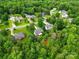 A scenic aerial view of a home situated among many lush green trees at 6530 Fly A Way Dr, Denver, NC 28037