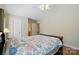 Cozy bedroom with a floral comforter and neutral walls at 6530 Fly A Way Dr, Denver, NC 28037