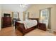 Bright bedroom with vaulted ceilings, wood-look floors, and natural light at 6530 Fly A Way Dr, Denver, NC 28037