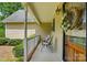 Cozy front porch with chairs and seasonal wreath offers a welcoming entrance at 6530 Fly A Way Dr, Denver, NC 28037