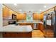 Traditional kitchen with wood cabinets, stainless steel appliances, and laminate countertops at 6530 Fly A Way Dr, Denver, NC 28037