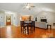 Open concept living room with hardwood floors, kitchen, and entry way at 6530 Fly A Way Dr, Denver, NC 28037