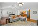 Spacious living area flows into kitchen and dining area, hardwood floors, vaulted ceilings and lots of natural light at 6530 Fly A Way Dr, Denver, NC 28037