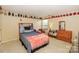 Inviting bedroom featuring closet storage, natural light, and closet shelving at 6873 Lakecrest Ct, Denver, NC 28037
