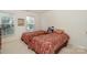 Cozy bedroom featuring two beds, natural light, and closet storage at 6873 Lakecrest Ct, Denver, NC 28037