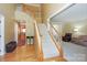 Grand foyer with hardwood floors, staircase, and views into the living room at 6873 Lakecrest Ct, Denver, NC 28037