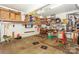 Organized garage space featuring ample storage shelving, tool organization, and car-themed decor at 6873 Lakecrest Ct, Denver, NC 28037